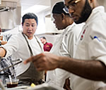 Chef Dana with BC culinary students in the kitchen